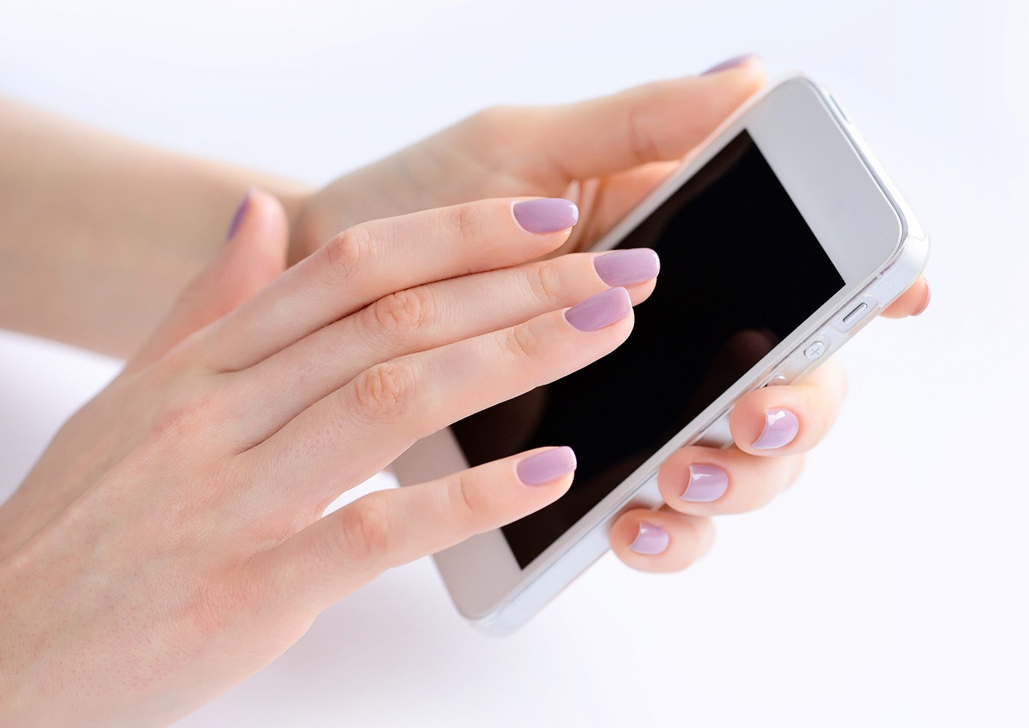 Women’s hands holding mobile phone, hand touching phone screen